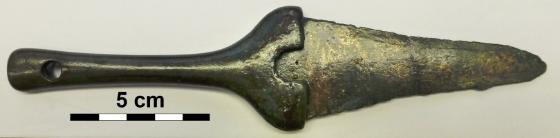 Late Bronze Age dagger from Koban, Republic of North Ossetia-Alania, Russia. The colour of the hilt was silverish while the blade had a warm, golden-like colour. The hilt contains about 9.8 wt.% arsenic and no tin, while the blade contains 10.1 wt.% tin, and no arsenic. Today, the dagger is very much corroded, so the original colours of the metals are not any more visible (Photograph © Naturhistorisches Museum Wien; inv.no. 41.268). 